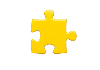 Obraz premium A vibrant yellow puzzle piece stands out against a stark black background.