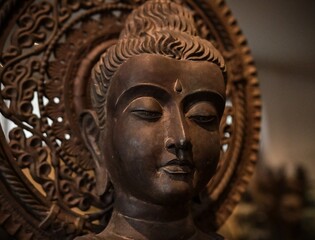 Obraz premium Buddha face head looking at wisdom light calm peace to nirvana way of life in Asian religion concept.