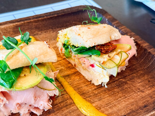 Closeup of sandwich with ham and vegetables. Fresh nutrition, flavor, and lifestyle food choice in modern dining.