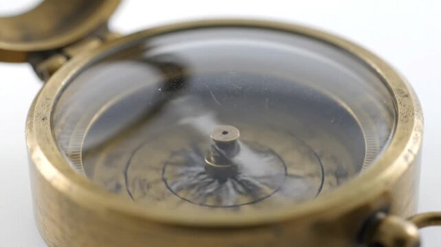 Close Up of Vintage Brass Compass Needle Slowly Settling and Finding North