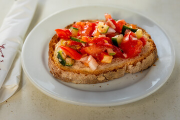 Bruschetta with fresh tomato and cucumber in Marsaxlokk.