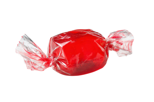 A red candy is sitting on a white background. The candy is wrapped in plastic and is sitting on a table