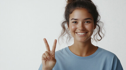 young woman showing victory sign with her fingers