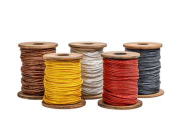 A row of five different colored spools of thread. The spools are yellow, white, red, brown, and black