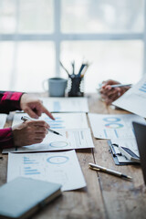 Business people analyzing financial charts and graphs showing market growth