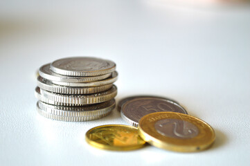 Polish Zloty Coins: Economy, Finance, and Savings. Close-up photo of a person's open hand holding various Polish coins, including 1 and 2 zloty denominations