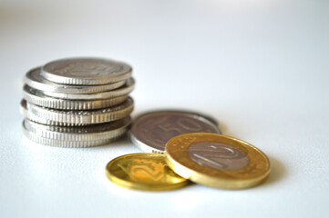 Polish Zloty Coins: Economy, Finance, and Savings. Close-up photo of a person's open hand holding various Polish coins, including 1 and 2 zloty denominations