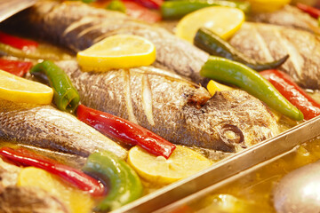 Freshly prepared fish dish with herbs and vegetables