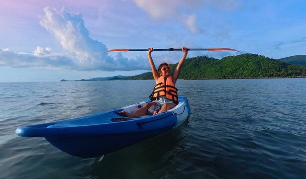 Happy holiday with asian woman traveller exploring calm tropical bay ,Travel and Active Lifestyle concept - Powered by Adobe