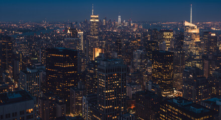 Fototapeta premium New York City Skyline at Night: Majestic Urban Landscape with Twinkling Lights