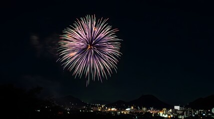 Fototapeta premium Colorful fireworks display over city at night