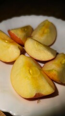 Apple slices on a white plate, a healthy and delicious snack option