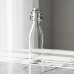 Elegant clear glass bottle with swing top on a marble surface, bathed in light