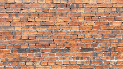 wide red brick wall texture with vintage worn surface and old masonry pattern