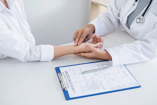 Doctor pulse measurement checking patient with examining, presenting results symptom and recommend treatment method, Healthcare and medical concept