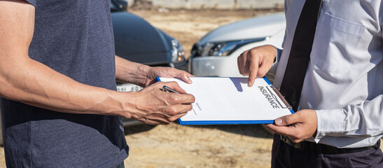 Insurance agent examine the damage of the car after accident on report claim form process