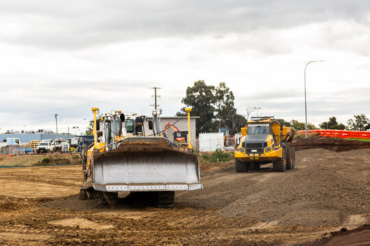 bulldozer and dump truck on construction site with earthworks building Singleton bypass