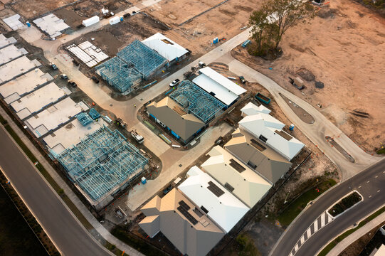 Aerial view of new home construction site with multiple houses in progress