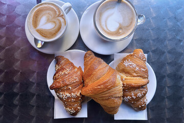 cup of coffee with croissants