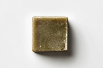 Olive-toned bar soap, square shape, studio shot