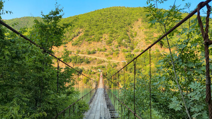 Suspension bridge over the river