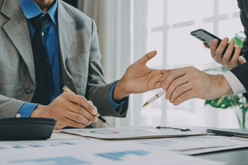 Accounting company provide finance and taxation planning for profitable cash flow, Auditor and accountant team working in office, analyze financial data and accounting record with calculator.Insight