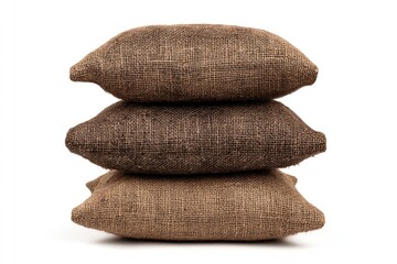 Three burlap pillows stacked vertically on a white background.  They are various shades of brown, showing texture
