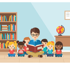 Teacher Reading Storybook to Happy Diverse Children in Classroom
