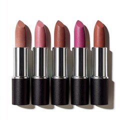The lineup of lipsticks showcases a range of warm tones and textures in various shades, making them perfect for adding a pop of color to any makeup look and expressing one's unique style