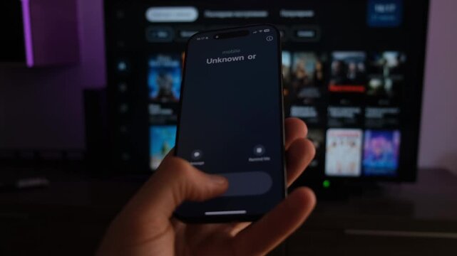 Fraud or fraudulent schemes. Close-up of a male hand holding a phone with an unexpected incoming call from an unknown
