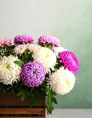 Obraz premium Colorful Chrysanthemum bouquet in wooden crate