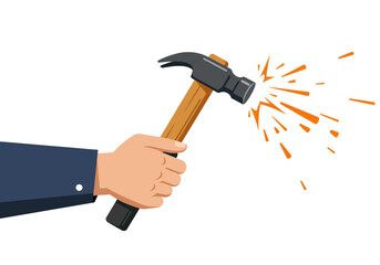 Closeup of a Hand Using a Hammer.