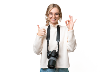 Young photographer English woman over isolated background showing ok sign and thumb up gesture