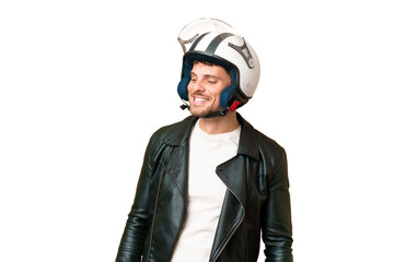 Brazilian man with a motorcycle helmet over isolated chroma key background looking to the side and smiling