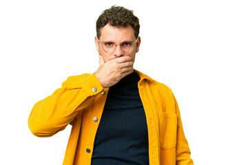 Brazilian man over isolated chroma key background covering mouth with hand