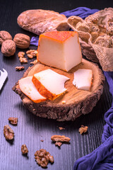 Cured cheese board with paprika and walnuts evoking an autumn snack scene