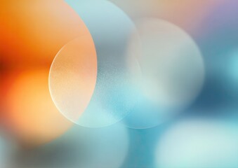 Abstract bokeh circles in soft orange, light blue, and pastel tones