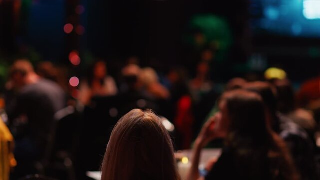 A visually intriguing, blurred background showcasing a bustling restaurant scene with lively diners