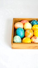 Colorful Easter eggs in a wooden box