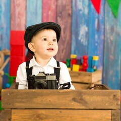 Baby photographer in wooden crate