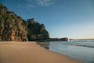Steep cliffs along the north end of Number One Beach at Seal Rocks