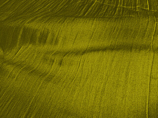 yellow linen textured fabric with folds and fine textile details