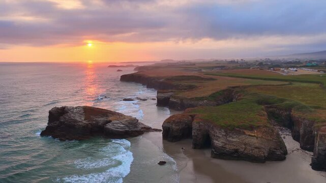 Sunrise aerial view of the Playa de Las Catedrales beach in Galicia region, northern Spain. Beautiful cliffs on famous Cathedral Beach, Cantabrian Coast 