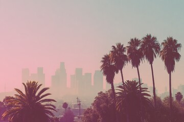 City skyline at dawn, hazy pastel colors, palm trees