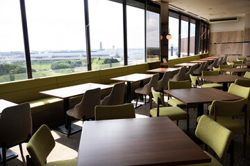 Interior modern building restaurant dining room of resort hotel for japanese people foreign travelers guests use service eat drinks Line cuisine gourmet buffet breakfast food at Narita in Chiba, Japan
