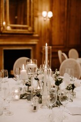 Winter wedding table setting centrepiece with candles
