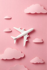 White airplane in pastel pink sky with clouds