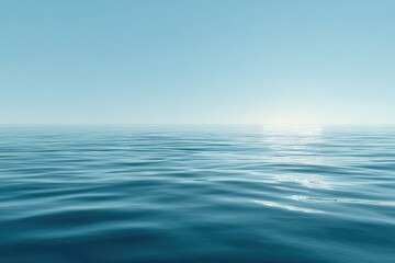 Calm, flat expanse of a tranquil blue sea meeting a pale blue sky