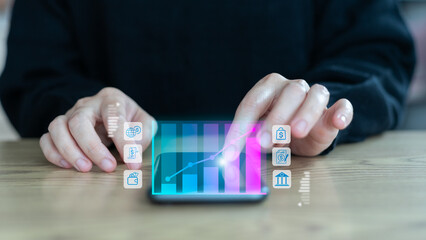 Person using smartphone with digital finance growth chart and fintech icons, representing online investment, mobile banking, and financial technology innovation.