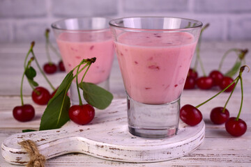 Healthy cherry smoothie with , on white wooden table. Close-up.	